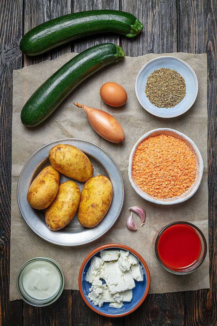 Ingredients for vegetarian moussaka with lentils, potatoes and zucchinis