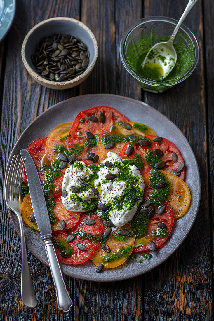 Tomato salad with burrata and parsley pesto