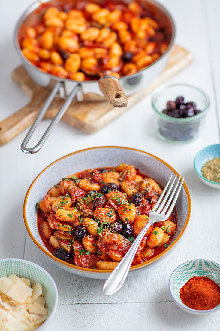 Gnocchi with tomato sauce, zucchini and olives