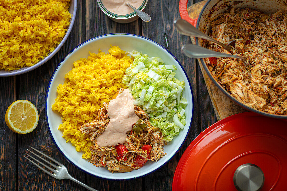 Pulled chicken with curry rice and salad