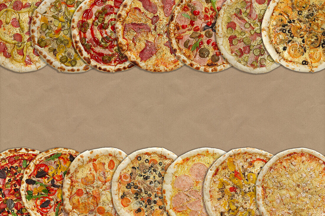 Various types of pizza on a cardboard background