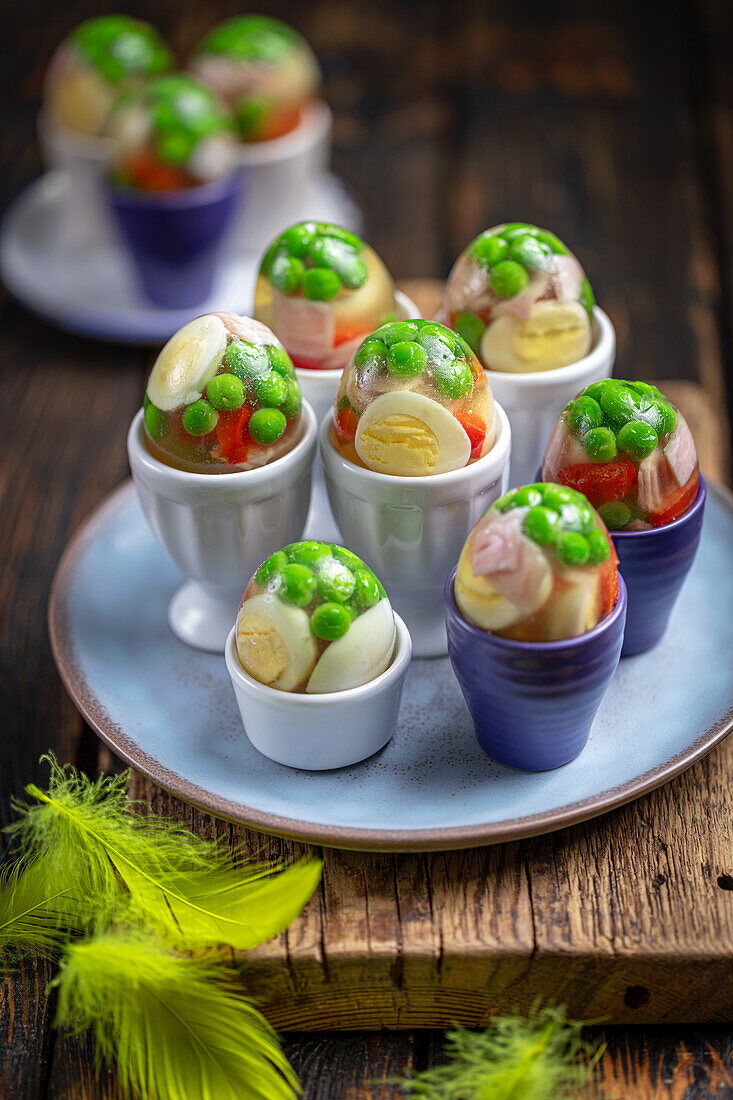 Aspic eggs with ham, quail eggs and vegetables