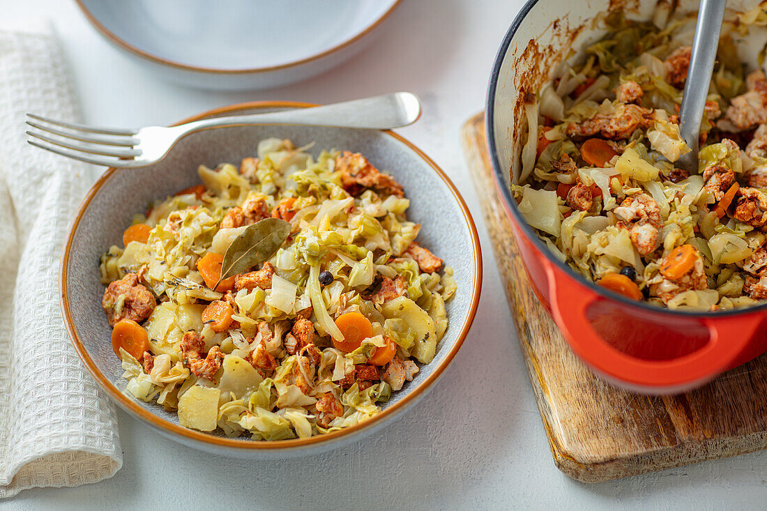 Potato and cabbage stew with carrots and chicken