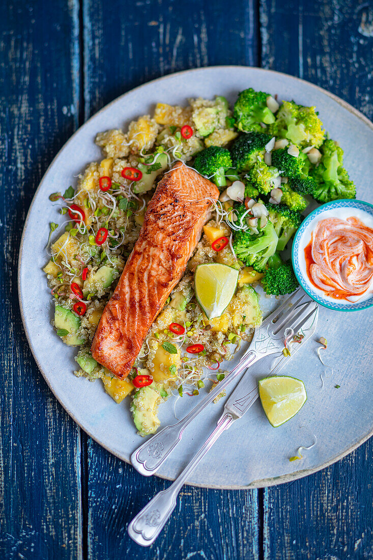 Salmon with couscous, mango, avocado and broccoli