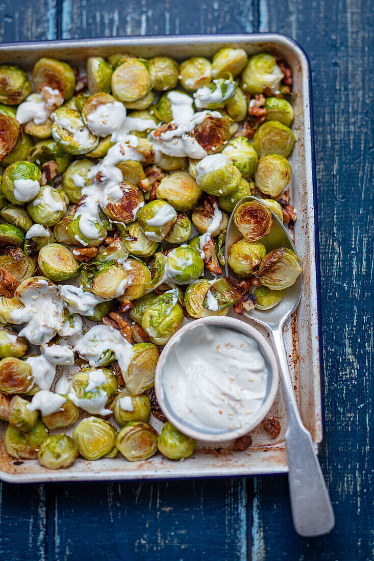 Baked Brussels sprouts with tahini-yoghurt dressing