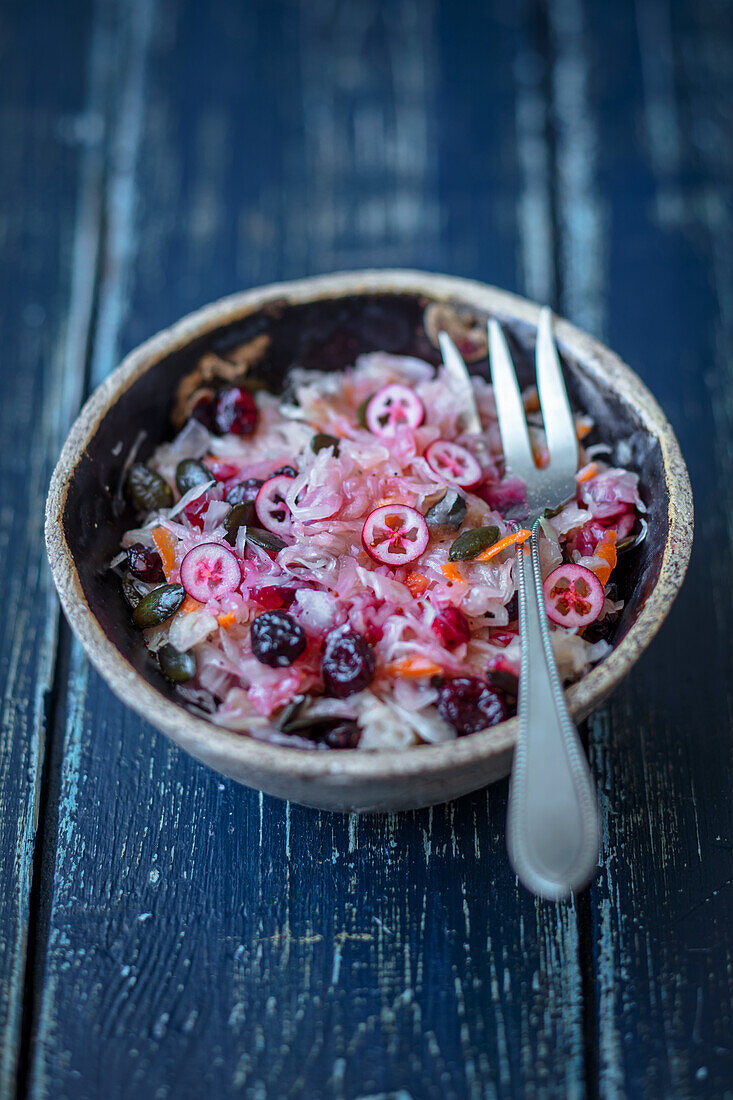 Sauerkraut salad with cranberries and pumpkin seeds