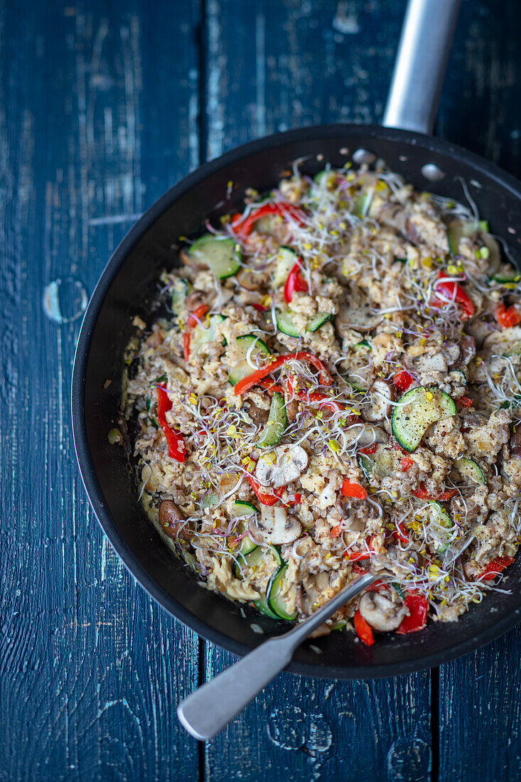 Scrambled eggs with barley and vegetables