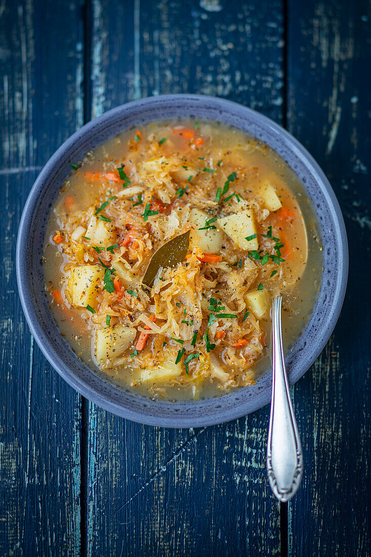 Sauerkraut soup with potatoes and vegetables