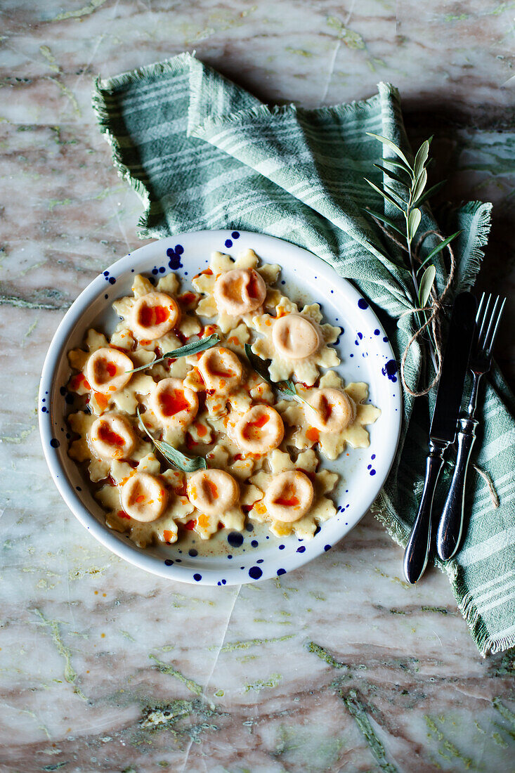 Ravioli filled with sausage and taleggio