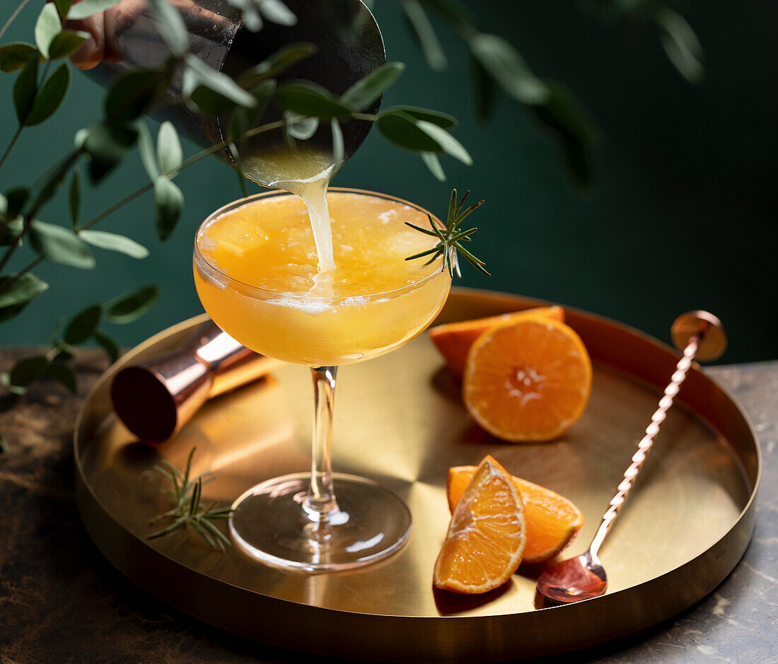 Orange cocktail with rosemary