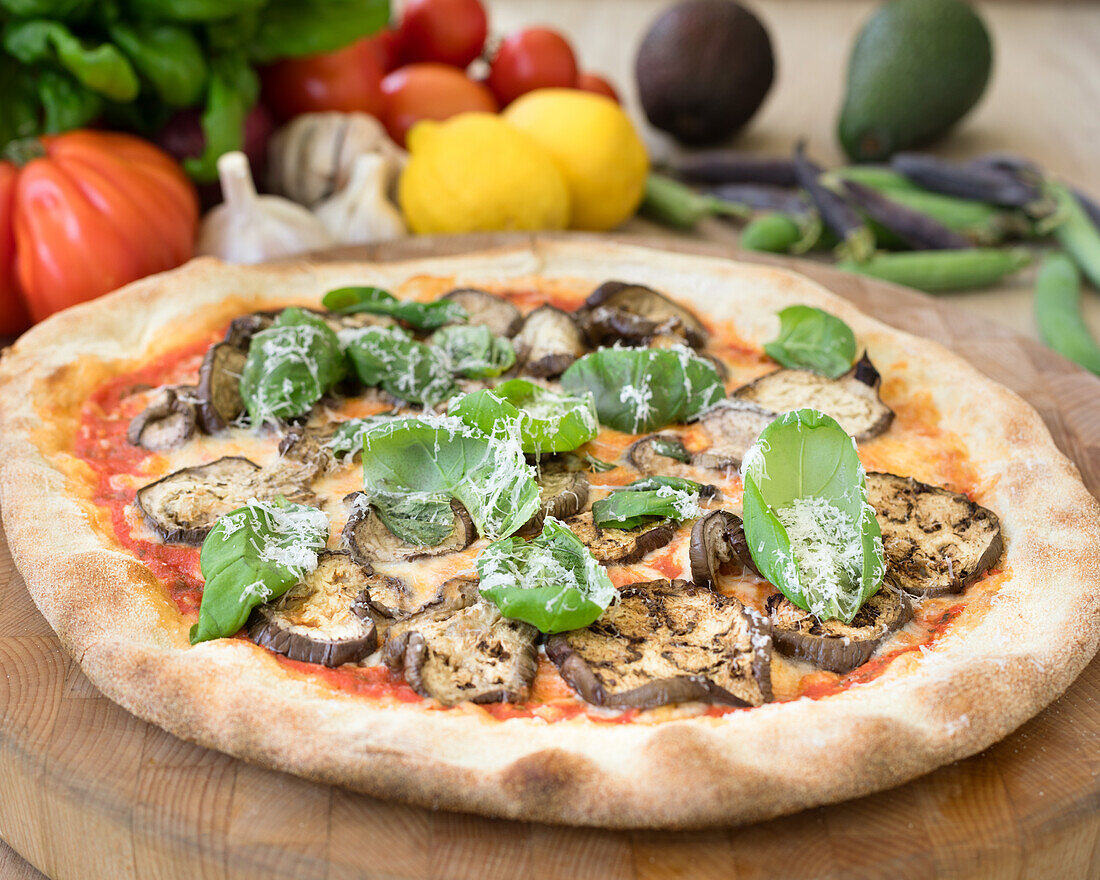 Pizza with aubergines and basil