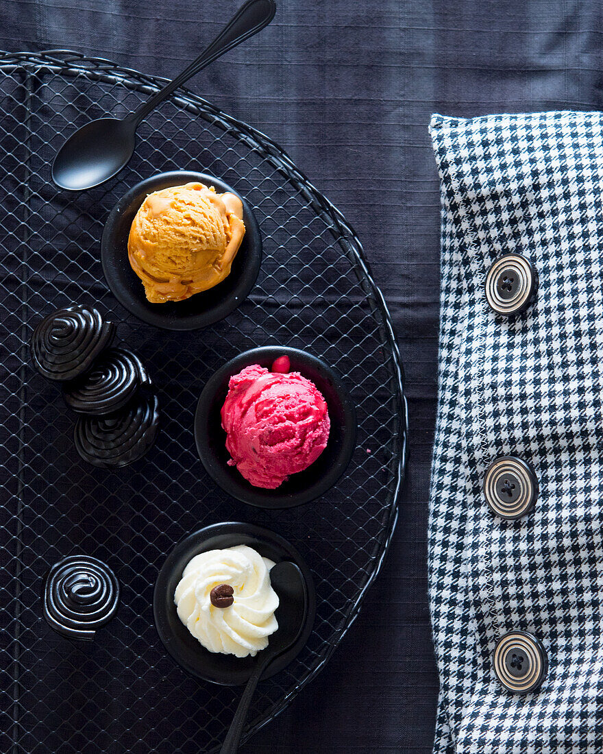 Liquorice ice cream, raspberry ice cream and whipped cream