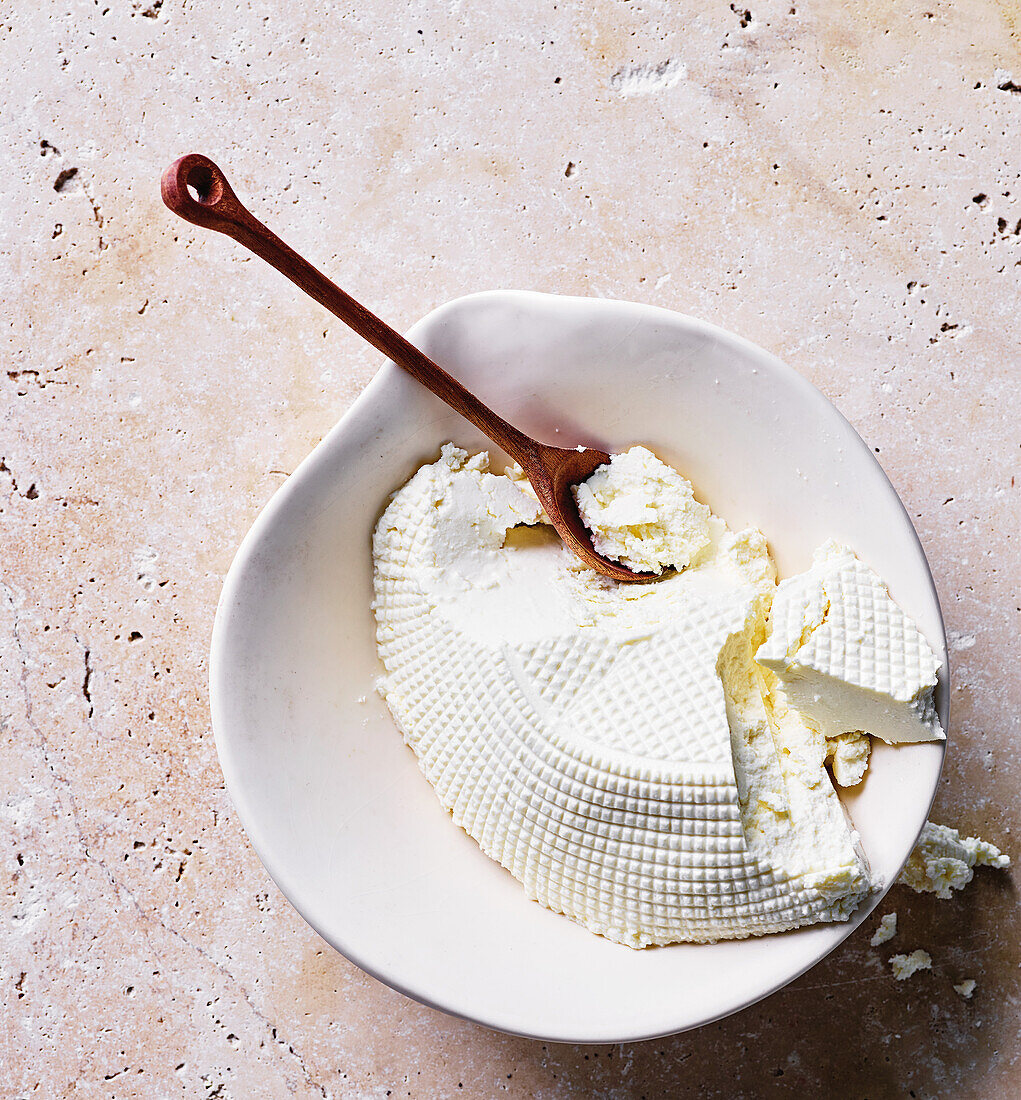 Fresh ricotta in a ceramic bowl