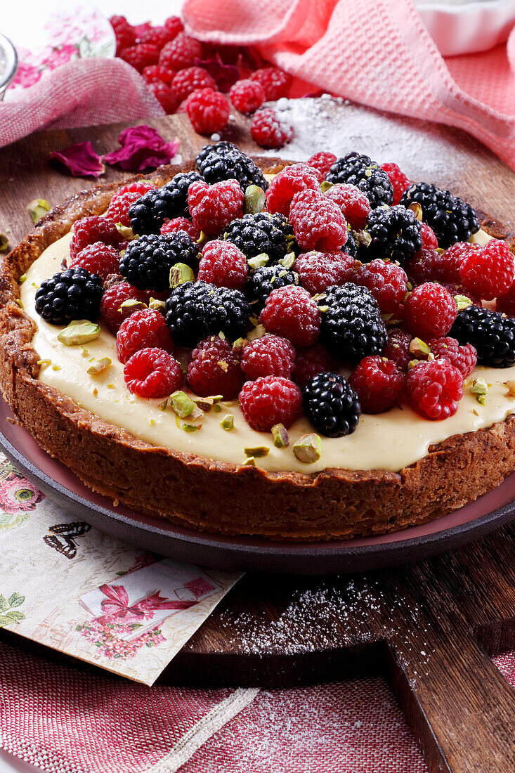 Vanilla cream tart with raspberries and blackberries