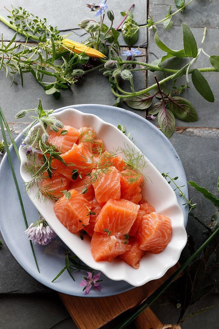 Salmon sashimi with fresh herbs