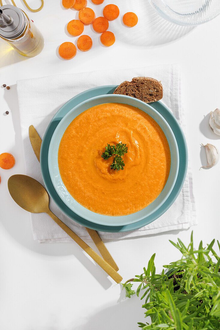 Creamy vegan carrot soup with fresh parsley