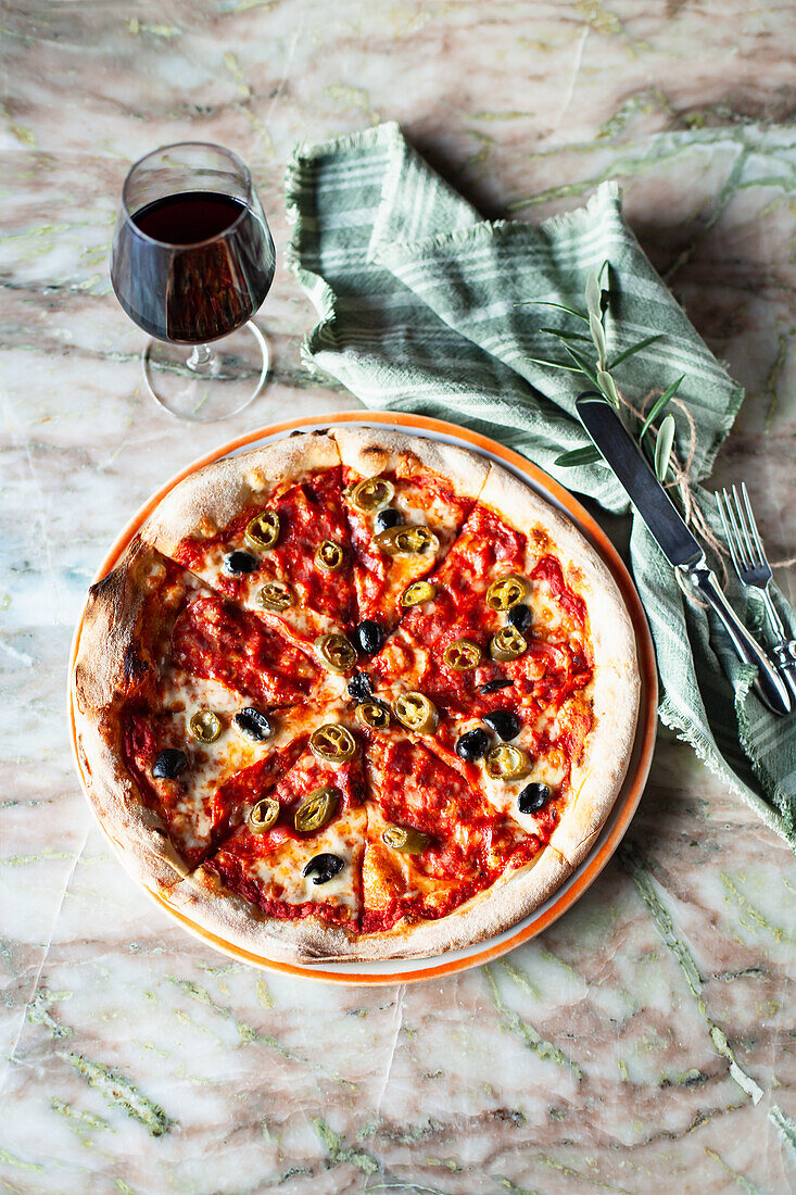 Pizza with green peppers and black olives