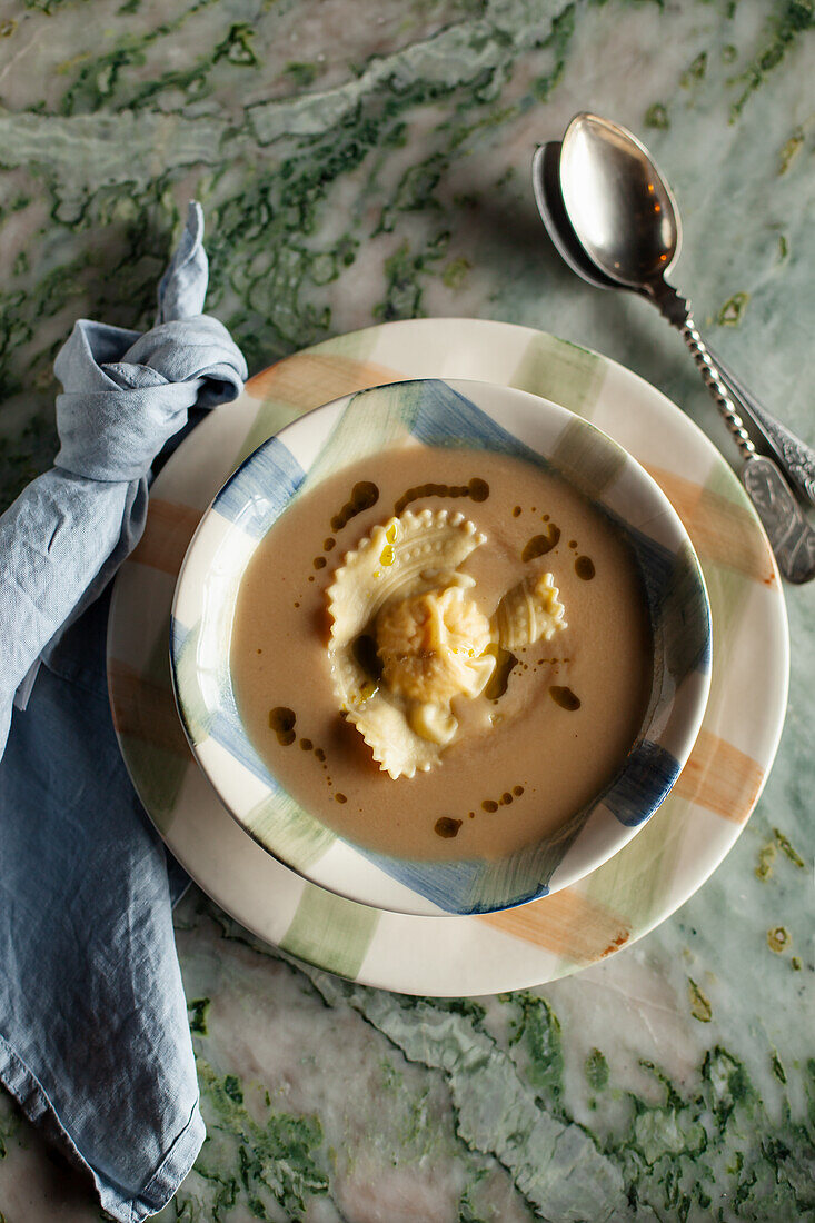 Cream of fennel soup with handmade ravioli