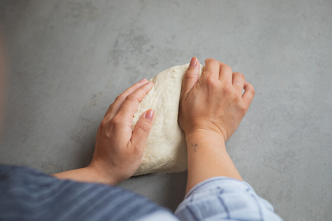 Kneading yeast dough for bread or pizza