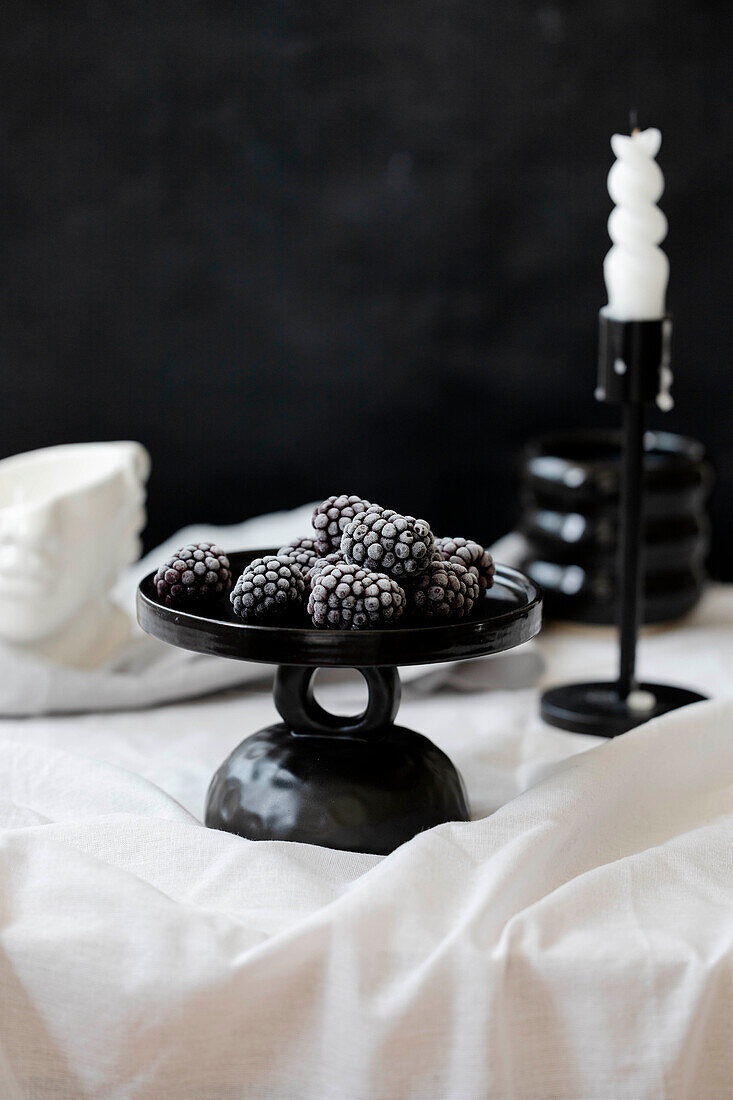 Blackberries on a black plate