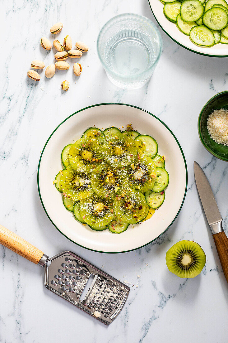 Cucumber and kiwi salad with grated pistachios