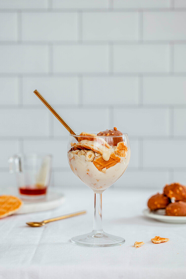 Ice cream sundae with waffles and biscuit crumbs