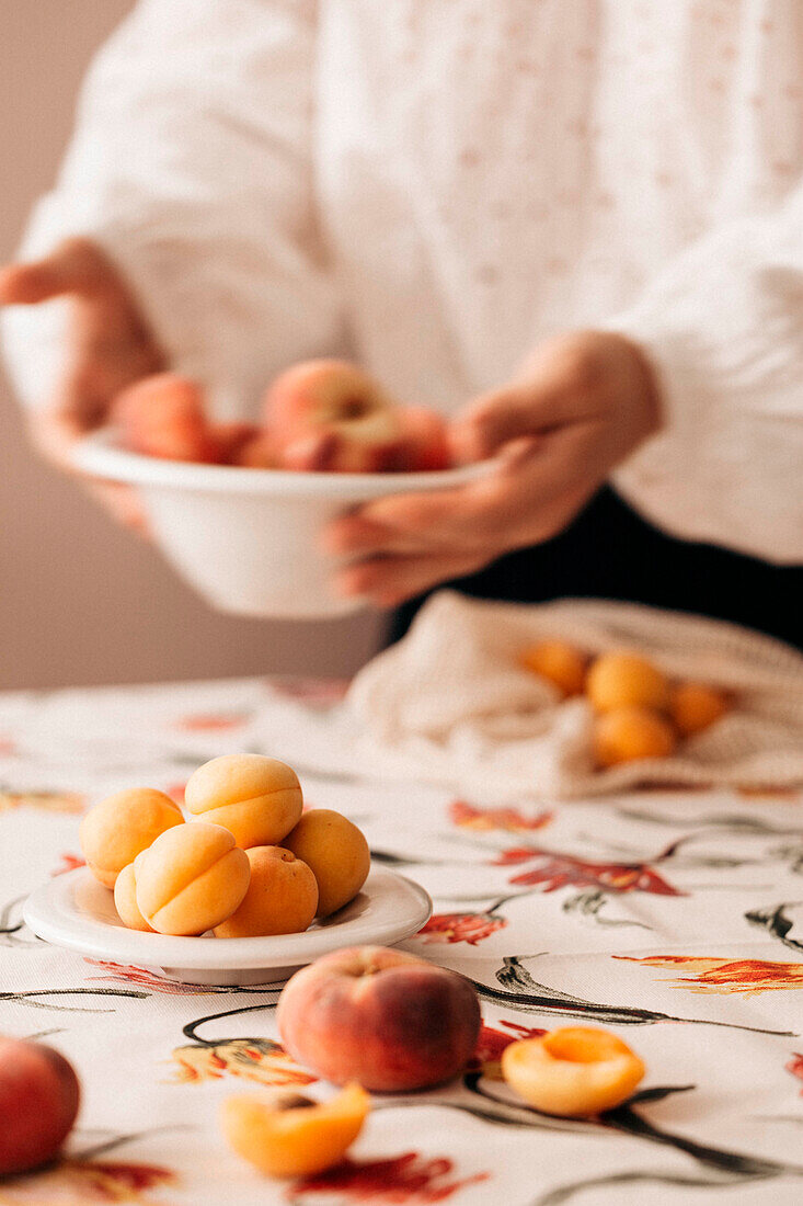 Fresh apricots and flat peaches