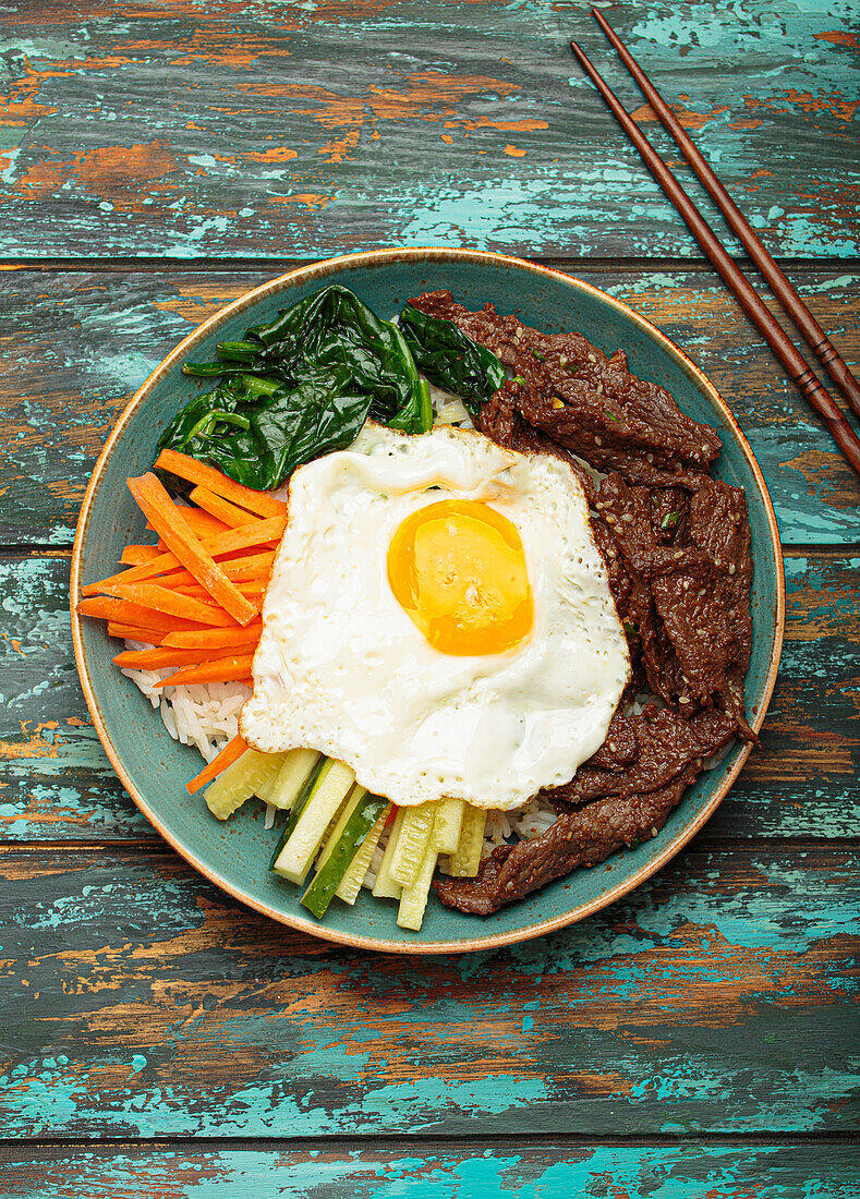 Bibimbap with beef, vegetables and fried egg