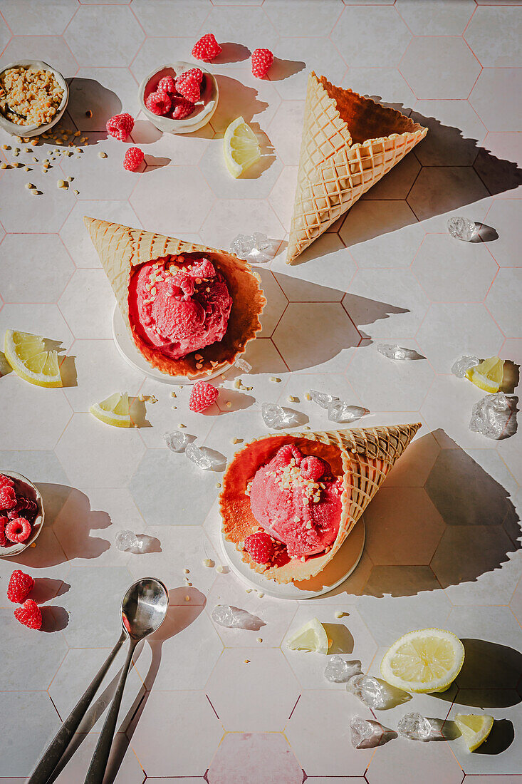 Raspberry ice cream in waffles with fresh raspberries and nuts