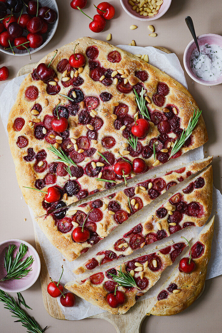 Focaccia with cherries, pine nuts and rosemary