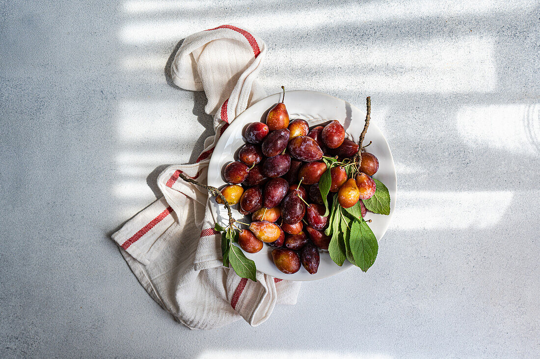 Bowl of ripe organic plums