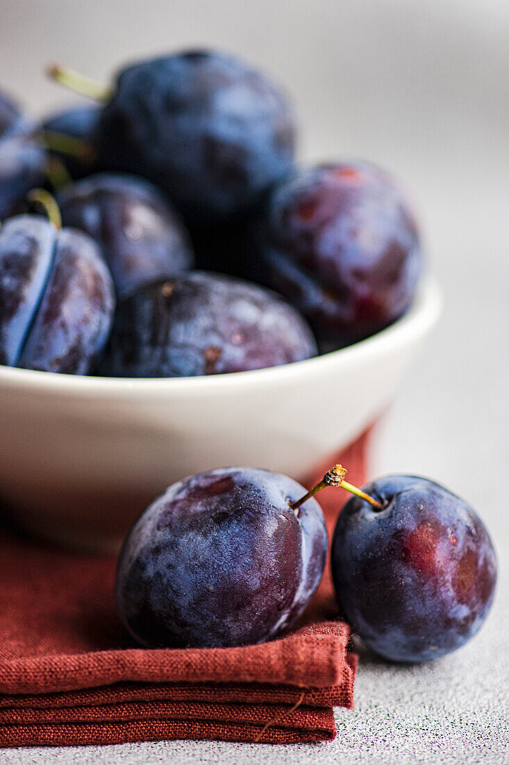 Bowl of fresh, ripe plums