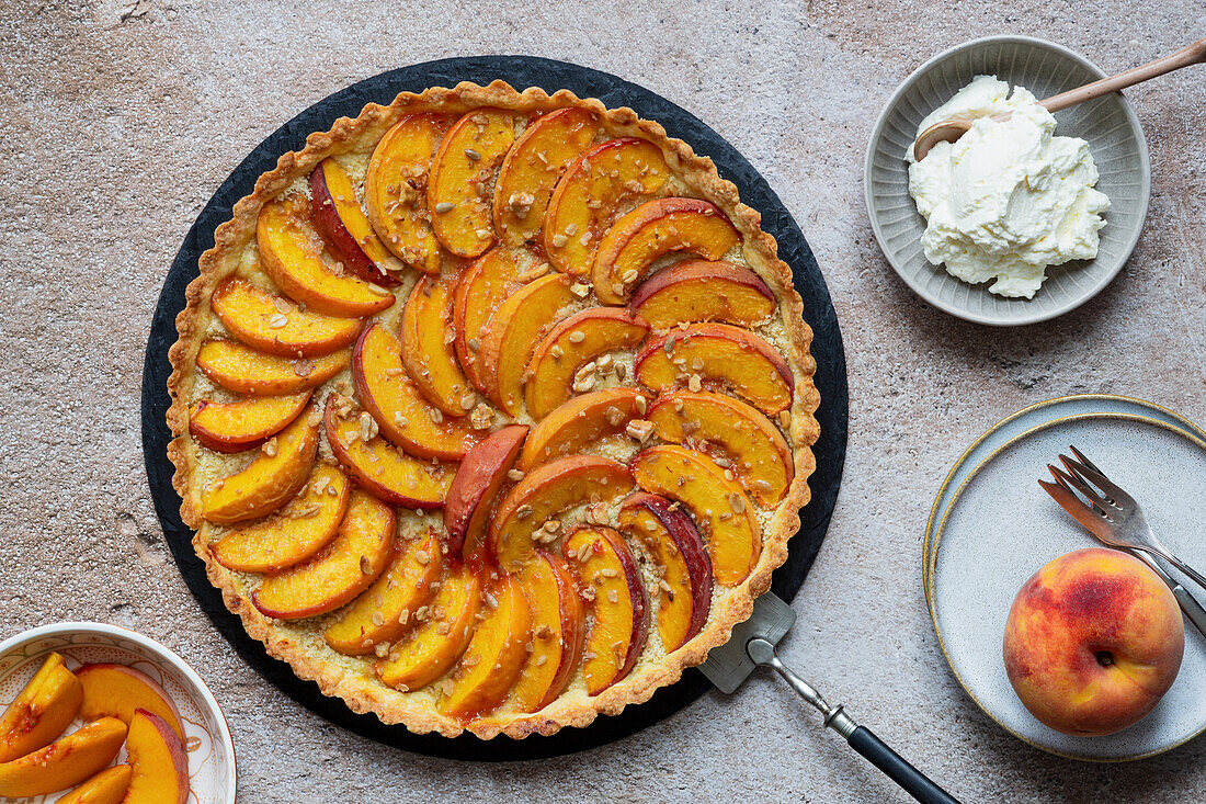 Peach tart with granola and walnuts with cream