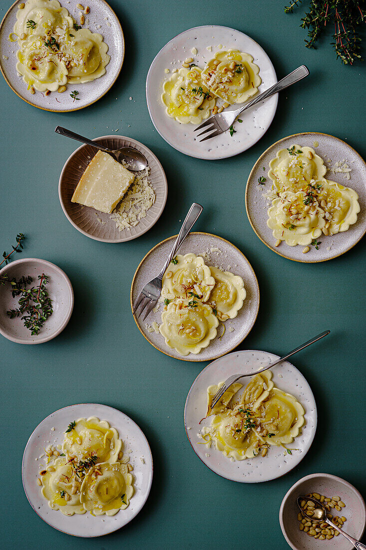 Ravioli with butter, parmesan, saffron threads, pine nuts and thyme