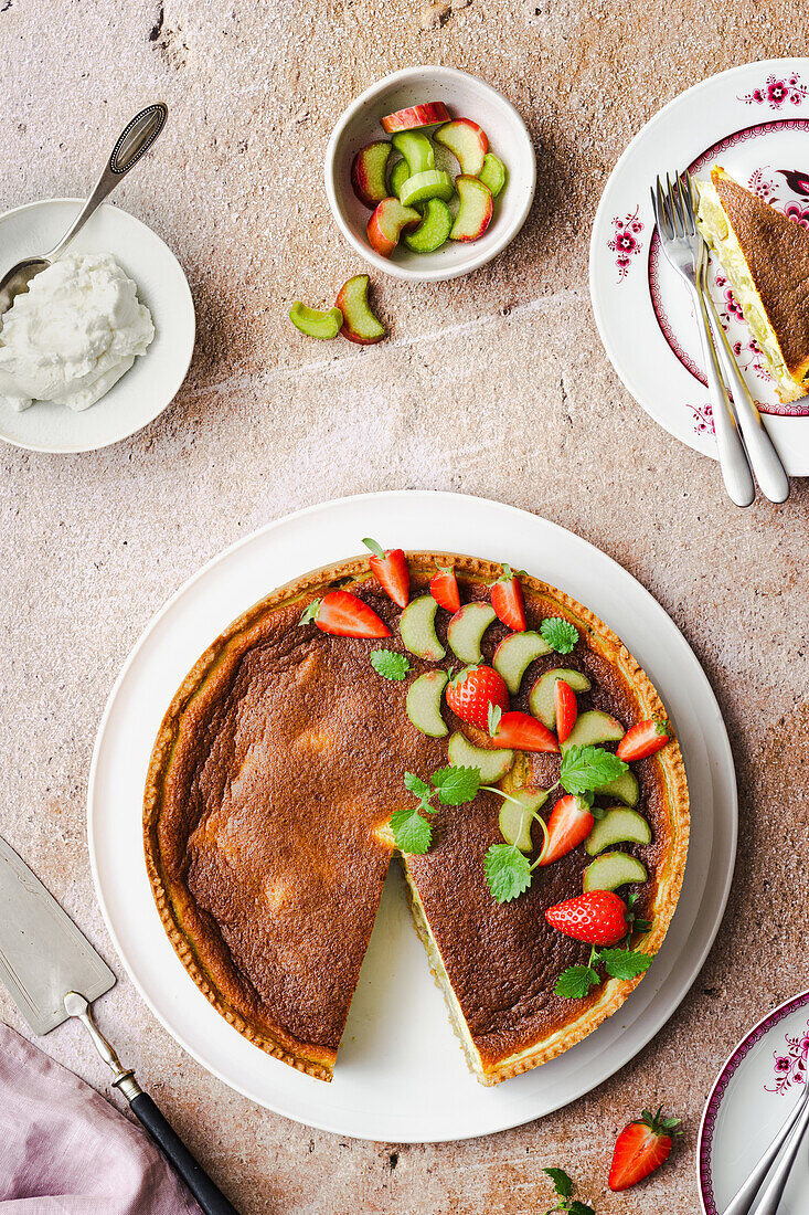 Rhubarb tart with strawberries and cream