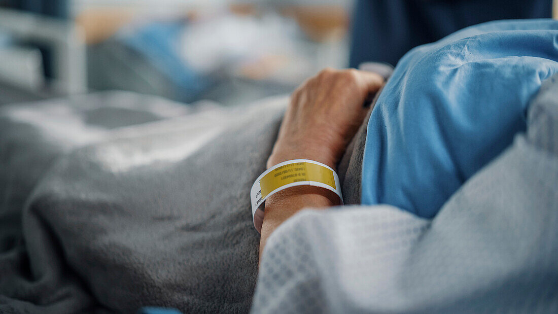 Patient lying in hospital bed