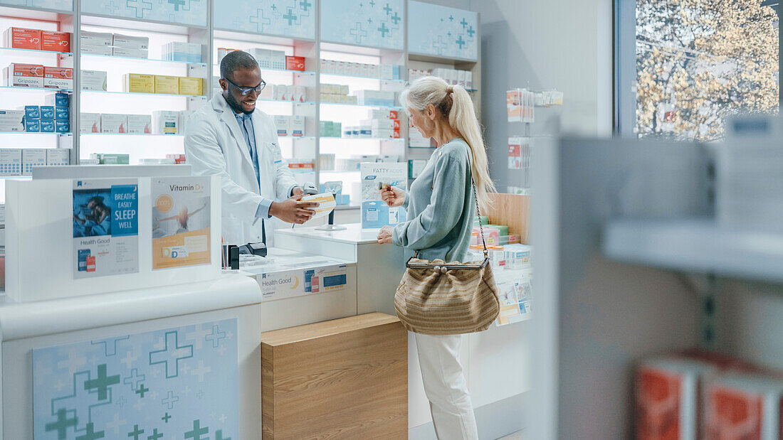 Female customers at pharmacy checkout