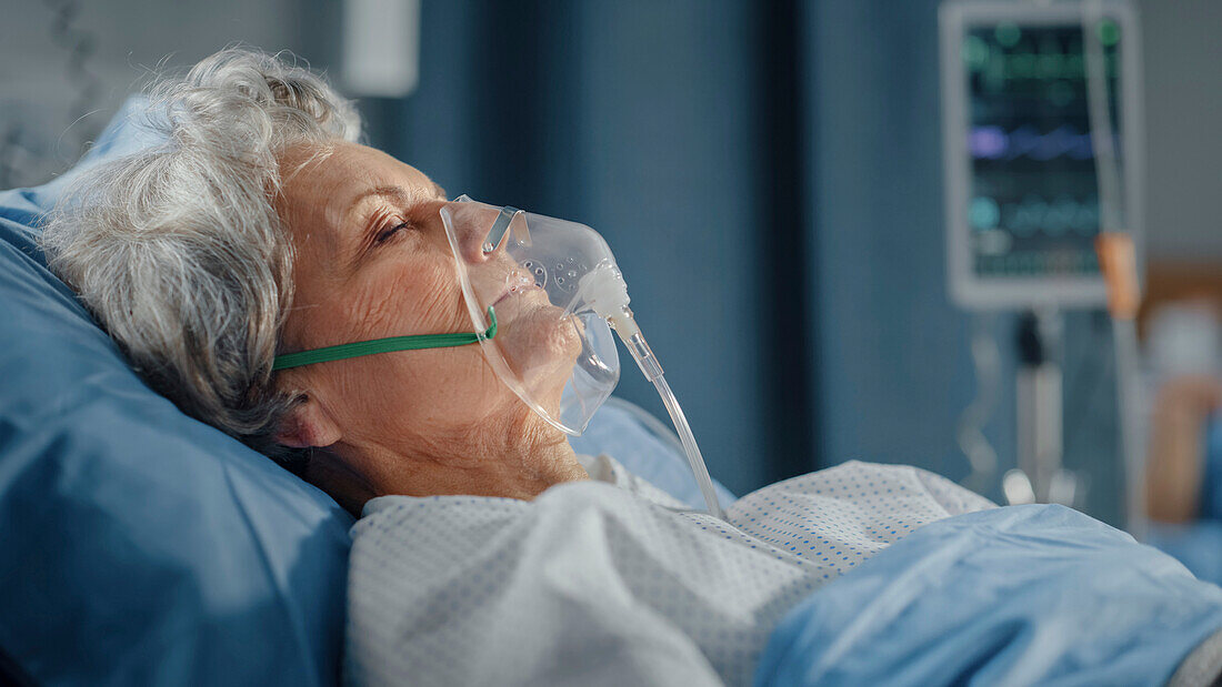 Elderly patient wearing oxygen mask