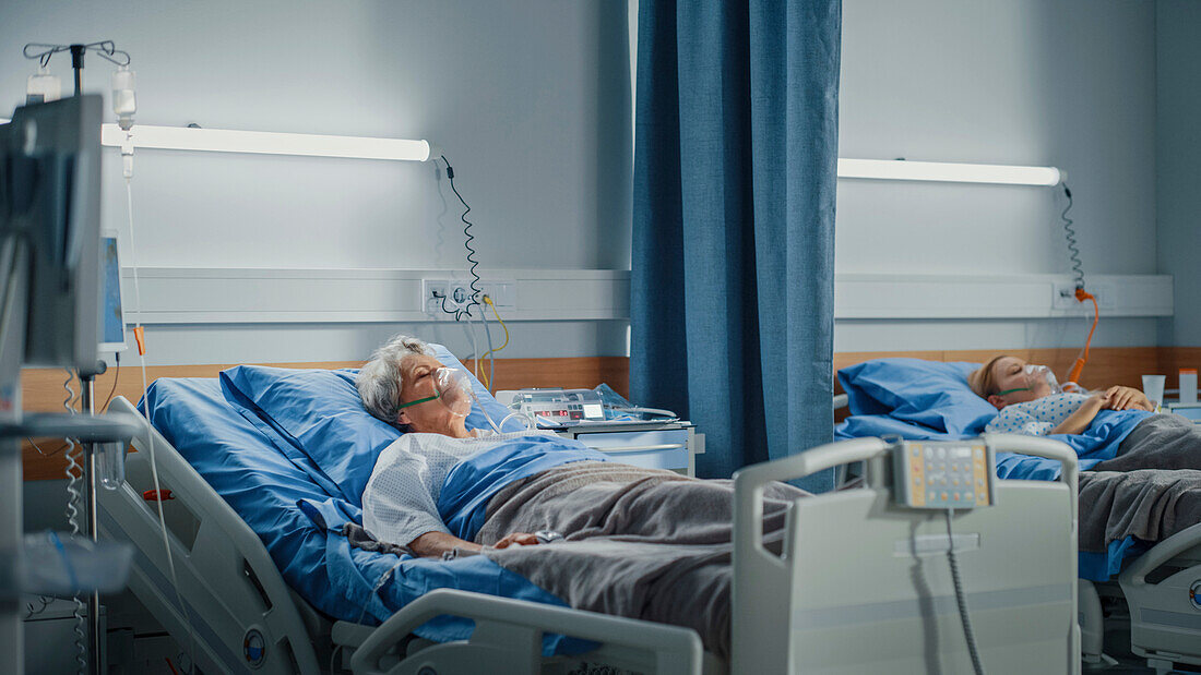 Elderly patient sleeping wearing oxygen mask