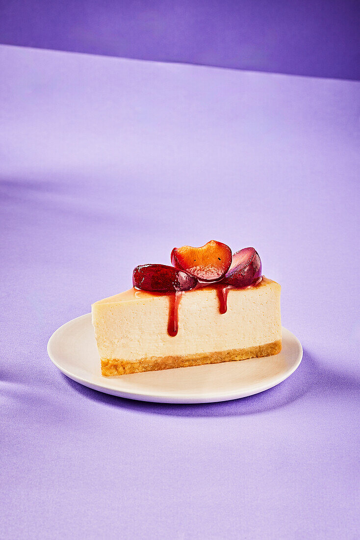 Baked almond cheesecake with earl grey plums