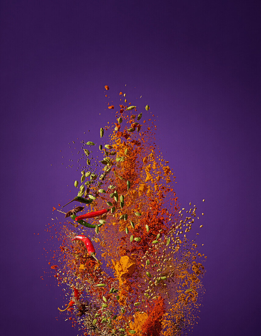 Explosion of spices against a purple background