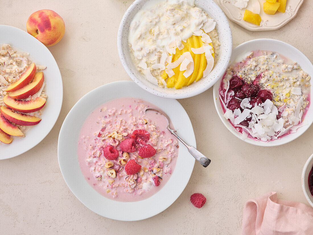 Overnight oats with raspberries, cherries, nectarines, mango and coconut flakes