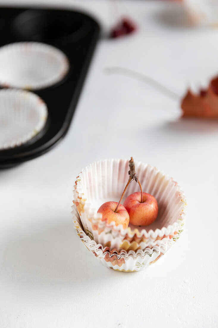 Small decorative apples in muffin cases