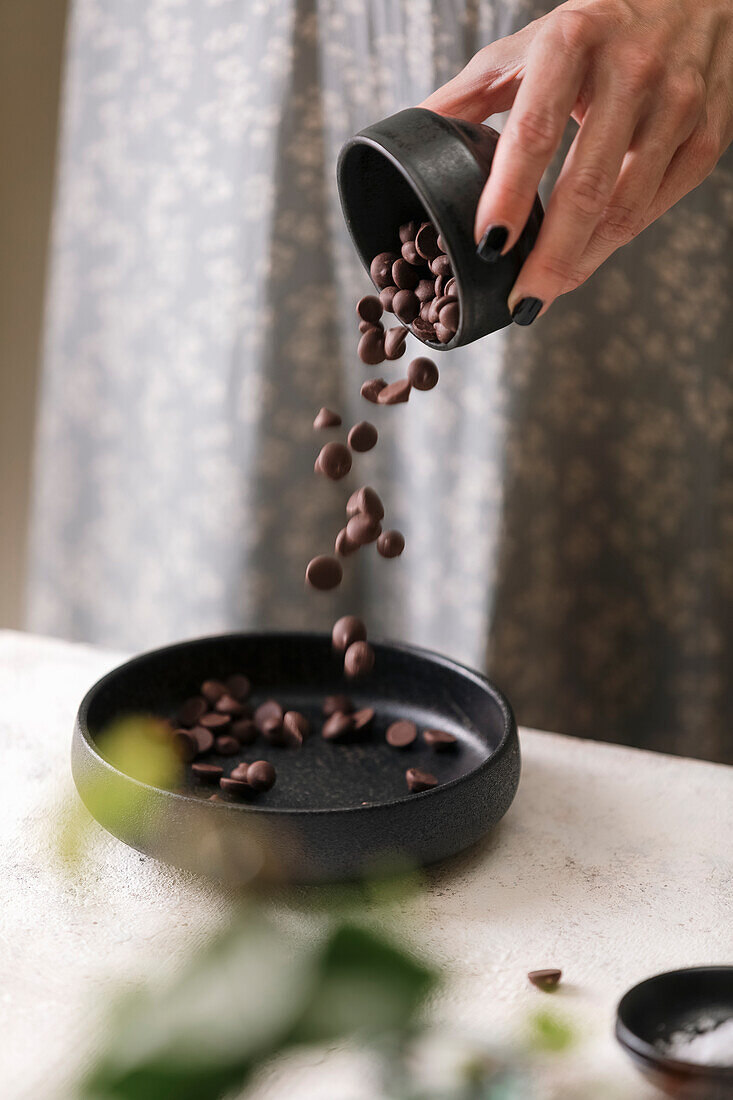 Pour chocolate drops into small bowls