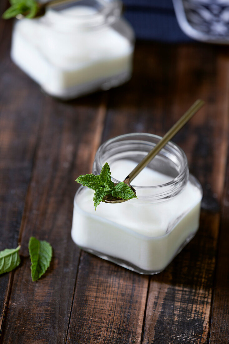 Panna cotta in a glass with mint