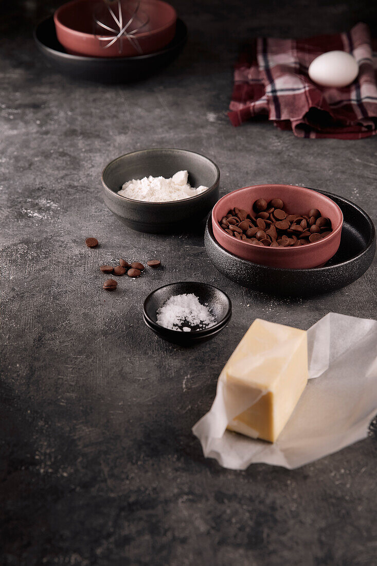 Ingredients for chocolate biscuits - butter, chocolate drops, flour, salt