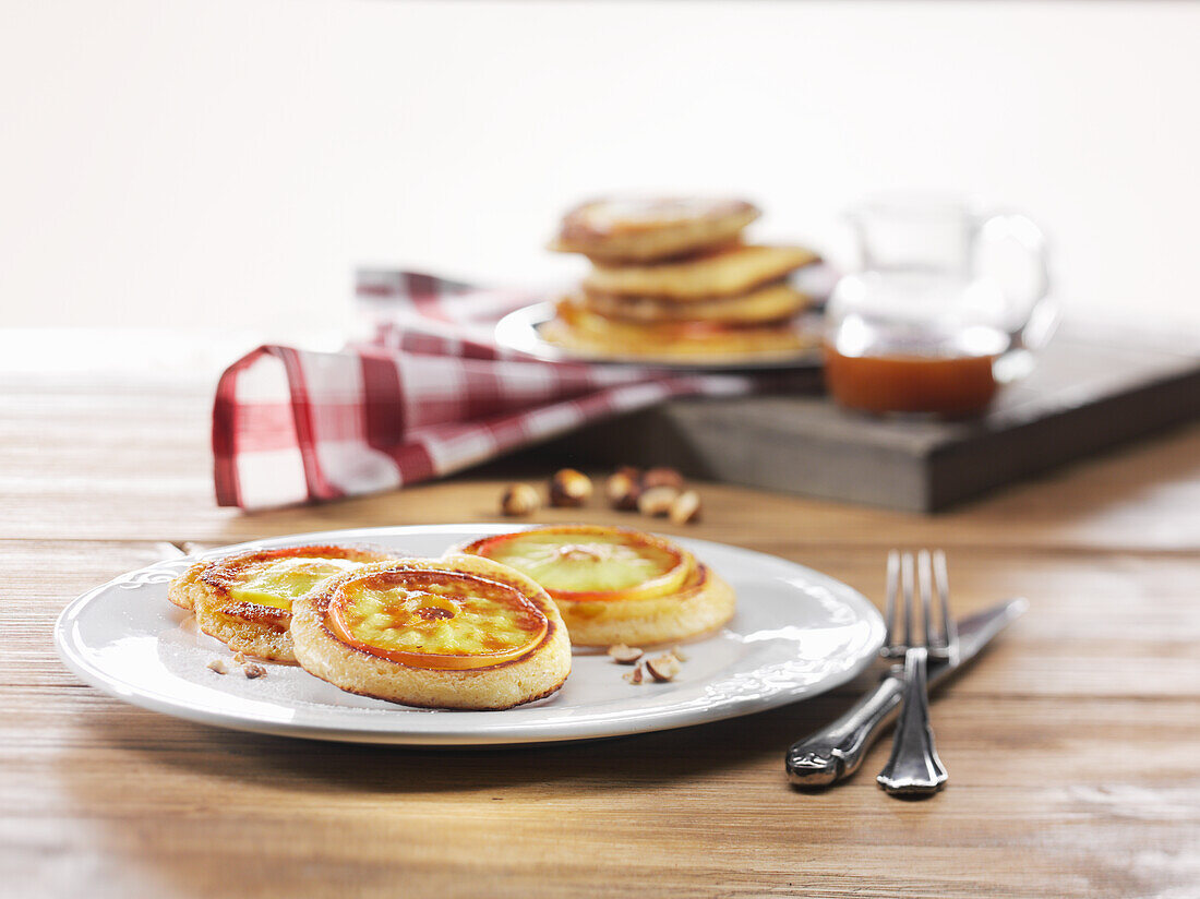 Pancakes with apple slices and hazelnuts