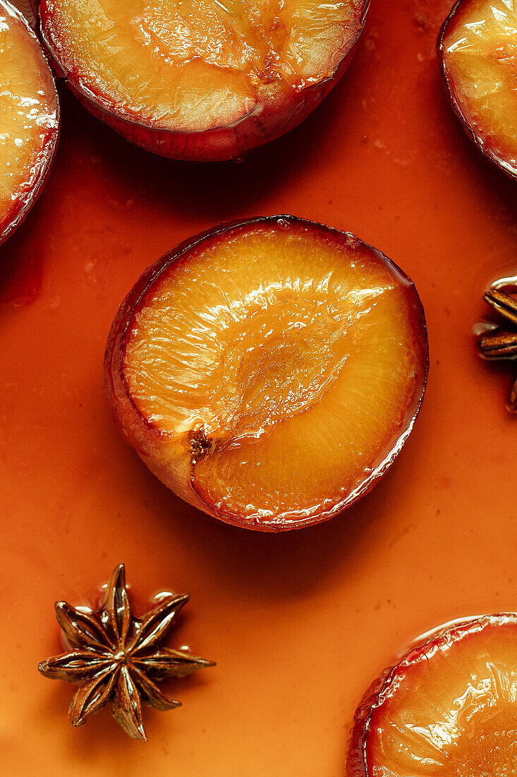 Plum halves in syrup with star anise