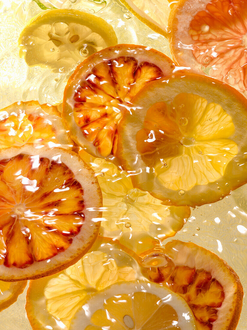 Lemon and blood orange slices in water