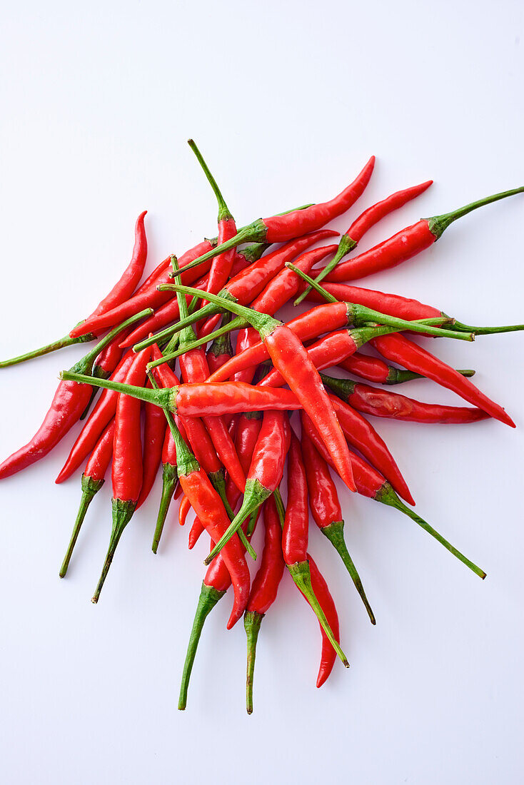 Red chilli peppers on a white background